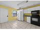 Sunlit kitchen with ample counter space, white cabinets, and modern appliances at 2173 Castle Pt, Winter Haven, FL 33880