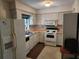 Functional kitchen featuring essential appliances and ample cabinet storage space at 220 Pinehurst Dr, Auburndale, FL 33823