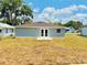 Exterior shot of a house with a yard, showcasing the backyard space at 2220 W Lanier St, Lakeland, FL 33815