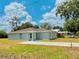 Exterior shot of the home, showcasing the front yard and driveway at 2220 W Lanier St, Lakeland, FL 33815