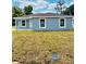 Inviting single-story home with a well-maintained lawn and a freshly painted exterior at 2220 W Lanier St, Lakeland, FL 33815