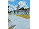 Charming single-story home with a long driveway and newly landscaped front yard at 2220 W Lanier St, Lakeland, FL 33815