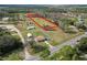 Spacious property showcasing a cozy home nestled within a large, verdant landscape at 2323 State Road 33, Clermont, FL 34714