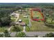 Expansive property featuring a charming home with a generous yard and lush surroundings at 2323 State Road 33, Clermont, FL 34714