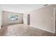 A spacious living room is enhanced by ample natural light from a large window at 236 Hillside Dr, Lakeland, FL 33803