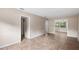 The living room boasts tile flooring and access to the kitchen and dining area at 236 Hillside Dr, Lakeland, FL 33803