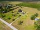 Bird's eye view showcases property, surrounding greenery, and roads at 2500 Brooke Rd, Fort Meade, FL 33841