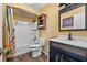 Cozy bathroom with tub, shower, wood-look flooring and modern vanity at 2500 Brooke Rd, Fort Meade, FL 33841