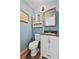 Bathroom with medicine cabinet, vanity, and toilet at 2500 Brooke Rd, Fort Meade, FL 33841