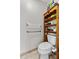 Full bathroom featuring a toilet, shelving, and safety bars at 2500 Brooke Rd, Fort Meade, FL 33841