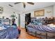 Bedroom with built-in storage, ceiling fan, and wood flooring at 2500 Brooke Rd, Fort Meade, FL 33841