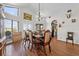 Bright dining area with wood flooring, a chandelier, and access to the kitchen and living spaces at 2500 Brooke Rd, Fort Meade, FL 33841