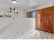 Welcoming entryway featuring tile flooring and a solid wood front door with glass inset at 2500 Brooke Rd, Fort Meade, FL 33841
