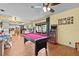 Spacious living room complete with pool table, arcade, and sliding doors to the back yard at 2500 Brooke Rd, Fort Meade, FL 33841