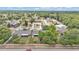 An aerial view shows the home in a suburban neighborhood with mature trees and green lawns at 2526 Fabry Cir, Orlando, FL 32817