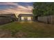 Expansive backyard featuring a screened-in patio, perfect for outdoor gatherings and relaxation in a private setting at 2526 Fabry Cir, Orlando, FL 32817
