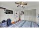 Bedroom featuring a ceiling fan and organized closet space at 2526 Fabry Cir, Orlando, FL 32817