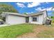 Cozy home featuring a well-maintained lawn and charming exterior details under a bright sky at 2526 Fabry Cir, Orlando, FL 32817