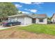 Well-maintained single-Gathering home with a two-car garage and a neat front lawn, showcasing suburban living at 2526 Fabry Cir, Orlando, FL 32817