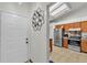 Bright kitchen with stainless steel appliances and tile floors, adjacent to the entryway at 2526 Fabry Cir, Orlando, FL 32817
