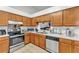 Functional kitchen with stainless steel appliances, tile floors and ample counter space at 2526 Fabry Cir, Orlando, FL 32817