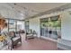 Cozy screened patio offers a peaceful retreat with comfortable seating and ample space for relaxing outdoors at 2526 Fabry Cir, Orlando, FL 32817