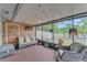 Enclosed patio featuring comfortable seating and serene backyard views at 2526 Fabry Cir, Orlando, FL 32817