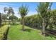 Nicely landscaped backyard with mature trees offers a peaceful outdoor setting for relaxation and enjoyment at 2569 Laurel Glen Dr, Lakeland, FL 33803
