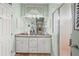 Well-lit bathroom features a double vanity with granite countertops and a shower at 2569 Laurel Glen Dr, Lakeland, FL 33803