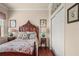 Comfortable bedroom with hardwood floors, antique furnishings, and a closet at 2569 Laurel Glen Dr, Lakeland, FL 33803