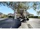 Elegant Clubhouse entrance with golf cart parking, manicured landscaping and beautiful architecture at 2569 Laurel Glen Dr, Lakeland, FL 33803