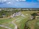 Aerial view of a well-maintained golf course clubhouse with manicured greens at 2569 Laurel Glen Dr, Lakeland, FL 33803