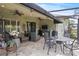 Charming covered patio with ample seating area for comfortable outside enjoyment with a beautiful outdoor view at 2569 Laurel Glen Dr, Lakeland, FL 33803