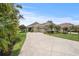 Beautiful home with lush landscaping and a long driveway at 2569 Laurel Glen Dr, Lakeland, FL 33803