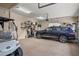 Clean garage space showcasing a stylish car and golf cart, offering convenience and luxury at 2569 Laurel Glen Dr, Lakeland, FL 33803