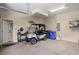 Spacious garage features ample storage space and a golf cart, perfect for community living at 2569 Laurel Glen Dr, Lakeland, FL 33803