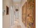 Inviting hallway showcasing beautiful artwork and neutral decor at 2569 Laurel Glen Dr, Lakeland, FL 33803
