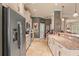 View of the kitchen with tile floors, granite counters, and stainless steel appliances at 2569 Laurel Glen Dr, Lakeland, FL 33803