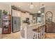 Kitchen with granite counters, stainless appliances, and breakfast bar with seating at 2569 Laurel Glen Dr, Lakeland, FL 33803