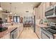 Kitchen with granite countertops, stainless steel appliances, and tile floors at 2569 Laurel Glen Dr, Lakeland, FL 33803