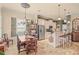 Kitchen and dining area with stainless steel appliances, granite counters and tile floors at 2569 Laurel Glen Dr, Lakeland, FL 33803