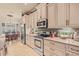 Kitchen featuring light cabinetry, stainless steel appliances, and tile floors at 2569 Laurel Glen Dr, Lakeland, FL 33803