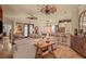 Living room with tile floors, ceiling fans, and a large sectional sofa at 2569 Laurel Glen Dr, Lakeland, FL 33803