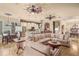 Open concept living room featuring tile floors, large windows, and an eat-in kitchen at 2569 Laurel Glen Dr, Lakeland, FL 33803