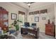 Well-lit home office with desk, chair, and large window offers an ideal workspace with natural light and privacy at 2569 Laurel Glen Dr, Lakeland, FL 33803