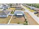 The property features a spacious backyard enclosed by a white fence and a screen enclosed porch at 2700 Oak Hammock Loop, Mulberry, FL 33860