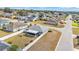 Aerial view of the property shows the backyard enclosed by a white fence and a screen enclosed porch at 2700 Oak Hammock Loop, Mulberry, FL 33860