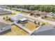 The property features a spacious backyard enclosed by a white fence and a screen enclosed porch at 2700 Oak Hammock Loop, Mulberry, FL 33860