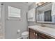 Well-lit bathroom with a white sink and vanity at 2700 Oak Hammock Loop, Mulberry, FL 33860