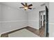 Bedroom with a ceiling fan and light neutral paint at 2700 Oak Hammock Loop, Mulberry, FL 33860